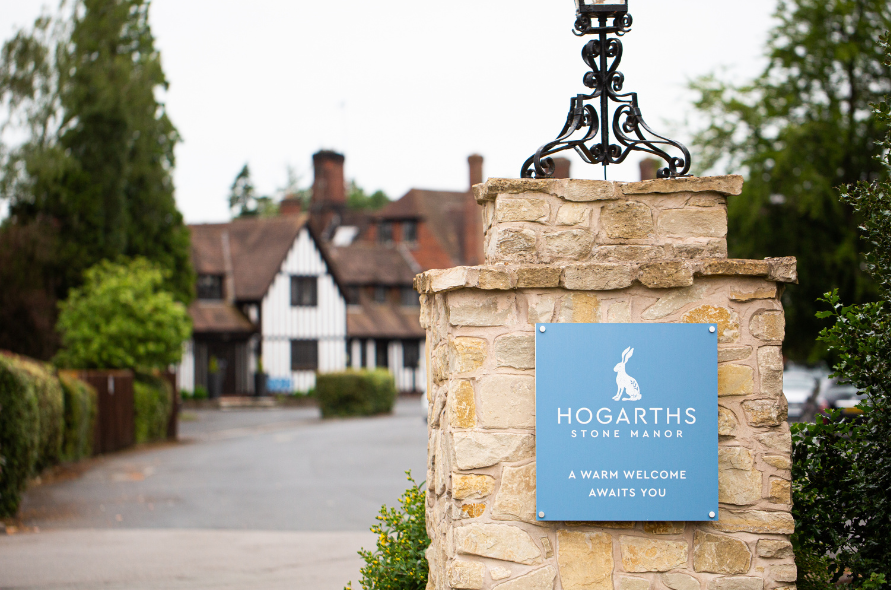 Entrance sign to Hogarths Stone Manor, welcoming guests arriving for weddings and special events.