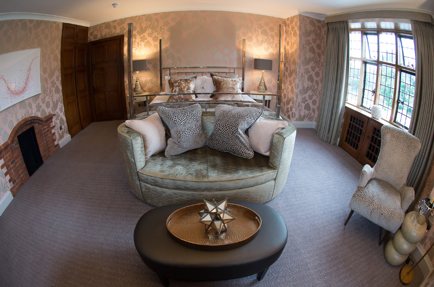 Cosy lounge area inside Stone Manor, showcasing traditional decor and comfortable seating.