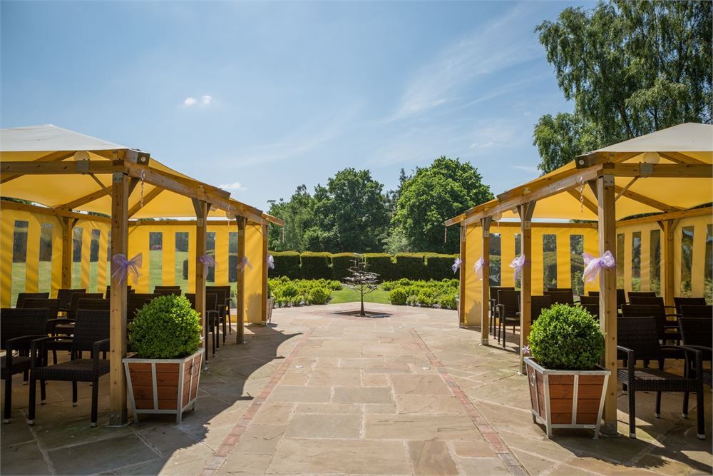 Courtyard view at Stone Manor, beautifully set up for al fresco wedding receptions and summer ceremonies.