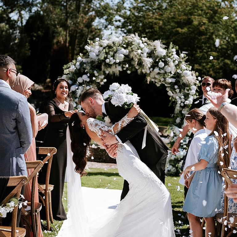 wedding couple - kissing after their ceremony. Worcestershire wedding venue.